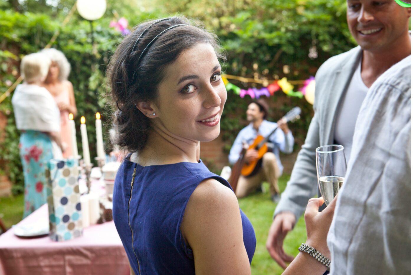 Woman enjoying a garden party with friends